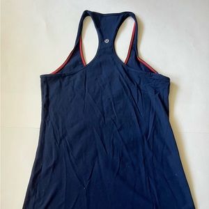 Cool Racerback, Navy with contrasting orange stitching.